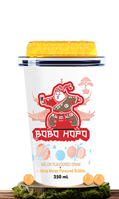 Bobohopo Melon Flavored Drink with Bobbing Mango Flavored Bubbles, 250 ml, resting on a green, earthy surface.