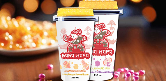 Bobohopo's refreshing orange and tropical flavored drinks with popping bubbles, perfect for a night out or a cozy evening.